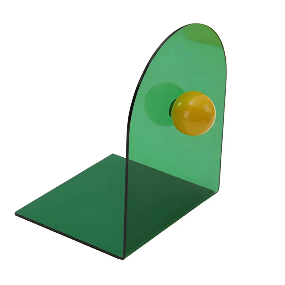 Bloc livres vert en acrylique avec boule jaune, structure en L visible en détail sur fond blanc.