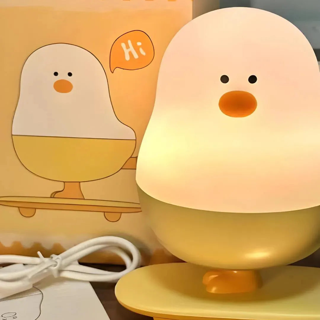 Lampe poussin skateur LED avec packaging original, câble USB et notice