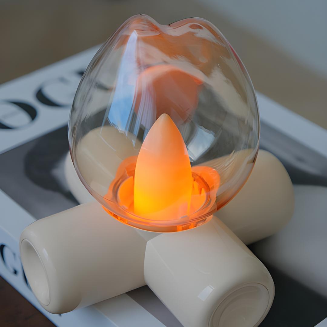 zoom sur lampe flamme posée sur un livre