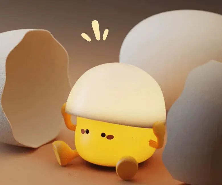 Veilleuse bébé & enfant Yolki Joy en forme d'oeuf entre 2 coquilles d'oeufs en éclosion