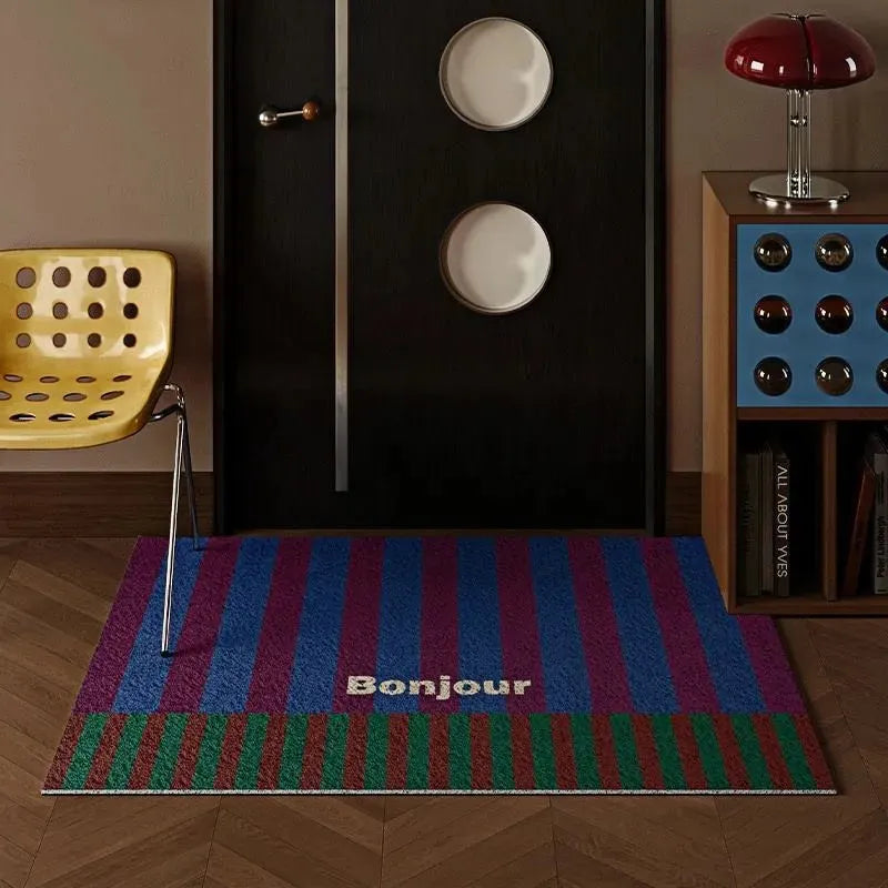 Paillasson coloré avec inscription Bonjour devant une porte noire, ambiance rétro moderne