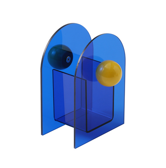 porte stylos style memphis bleu et jaune sur fond blanc