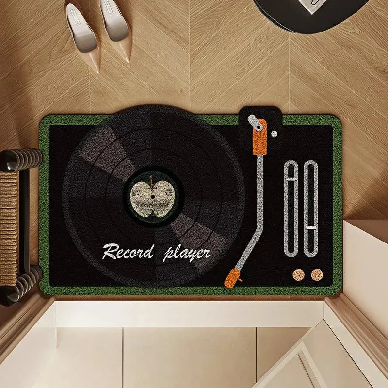 Tapis vinyle noir style platine rétro avec pomme au centre, mention “Record player”