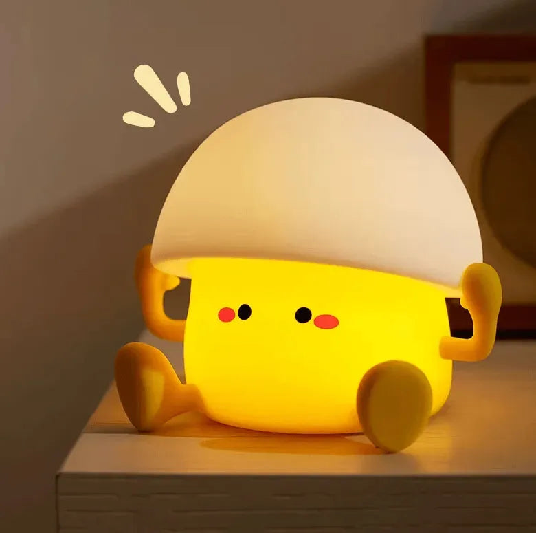 Veilleuse bébé & enfant Yolki Joy en forme d'oeuf posé sur table angle différent