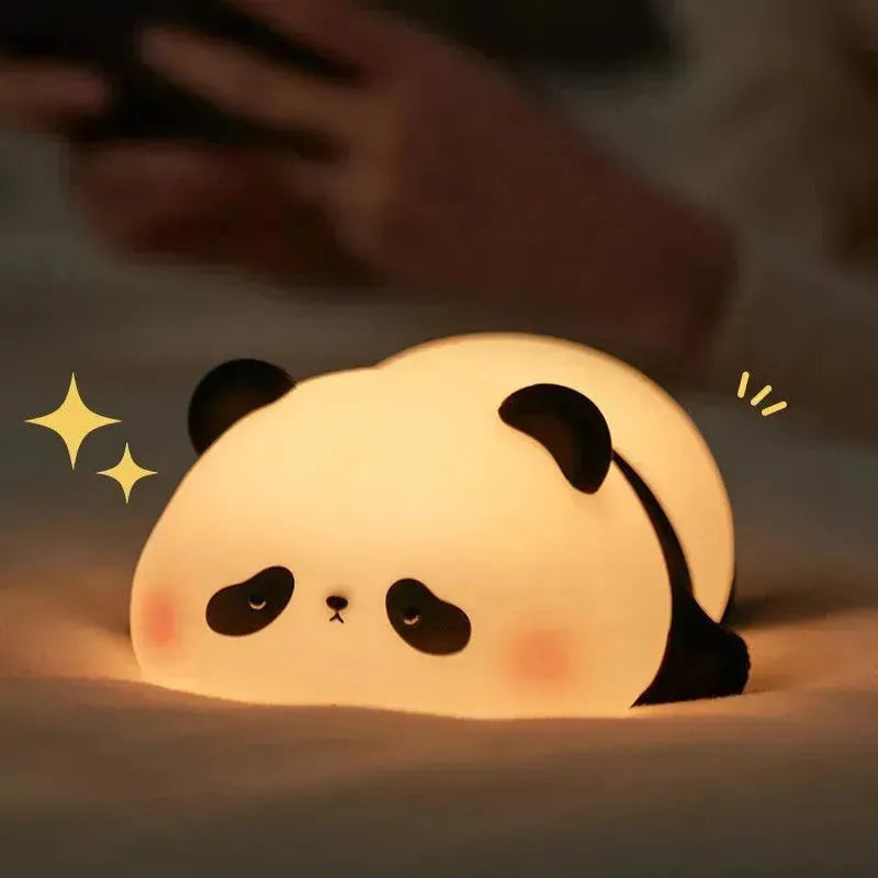 veilleuse panda allongée sur le ventre